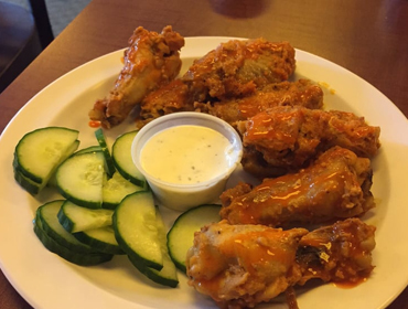 Our Hot wings dish with side of Sliced Cucambers