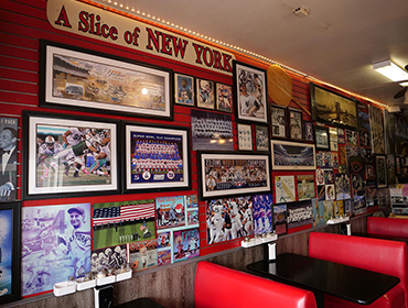 Our Seal Beach restaurant filled with many sports memorabilia hanging from the wall